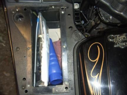 left storage box used to hold registration and handy items for easy access on the road